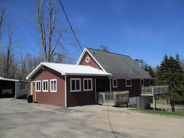 6876 Old Alba Rd, Gaylord, MI 49735 - view of front of property featuring driveway and metal roof