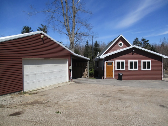 6876 Old Alba Rd, Gaylord, MI 49735 - garage with a detached garage and dirt driveway