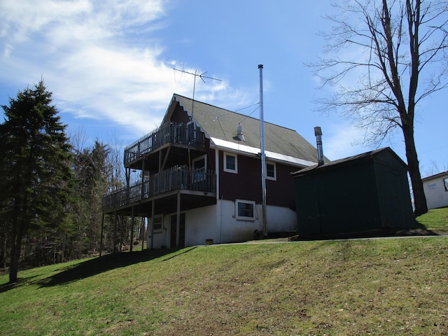 6876 Old Alba Rd, Gaylord, MI 49735 - rear view of property featuring a yard and a deck