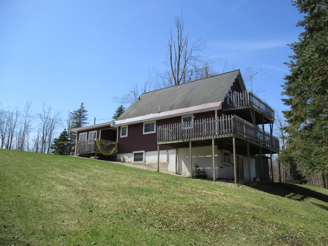 6876 Old Alba Rd, Gaylord, MI 49735 - back of property with a lawn and a deck