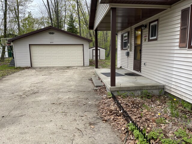 605 Englewood Dr, Roscommon, MI 48653 - detached garage with a storage unit