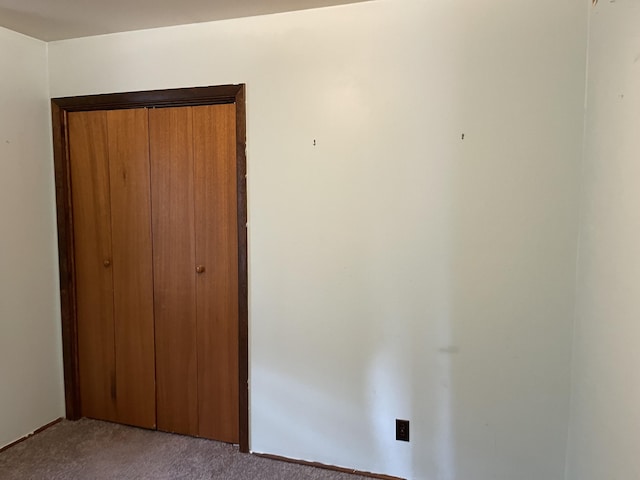 605 Englewood Dr, Roscommon, MI 48653 - unfurnished bedroom with carpet floors and a closet