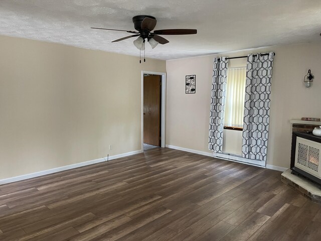 605 Englewood Dr, Roscommon, MI 48653 - unfurnished room featuring dark wood-style floors, ceiling fan, baseboards, and a textured ceiling