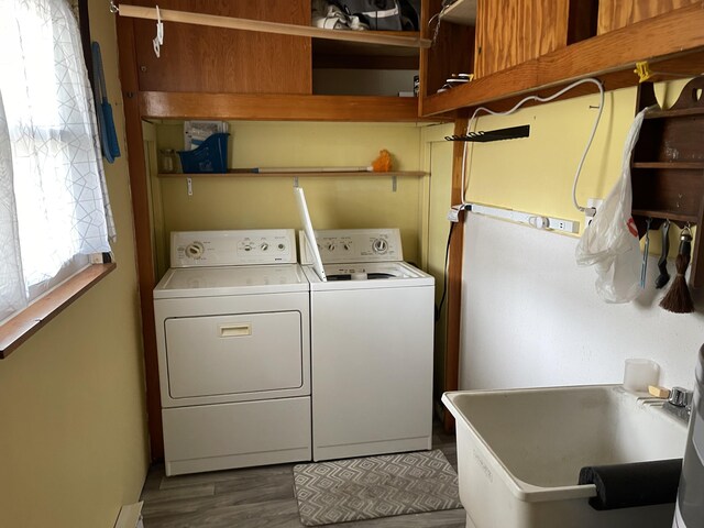 605 Englewood Dr, Roscommon, MI 48653 - laundry area featuring washing machine and clothes dryer and dark wood finished floors