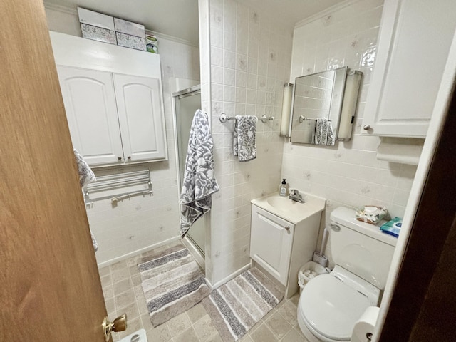 full bath featuring toilet, tile walls, a stall shower, and vanity