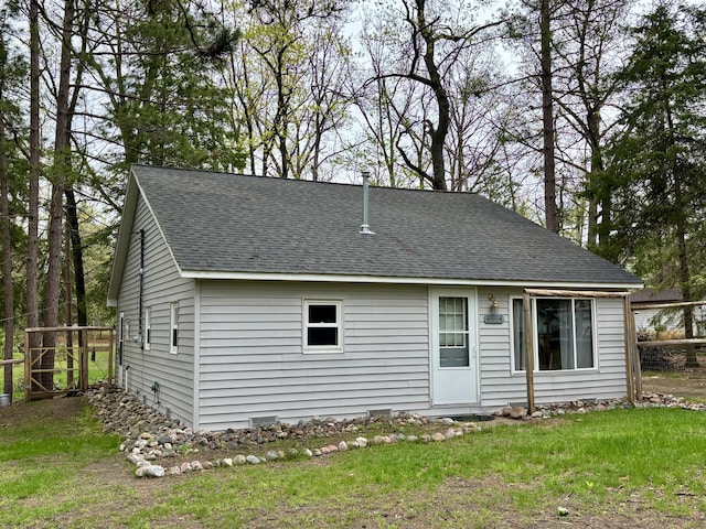 4804 Basil Dr, Comins, MI 48619 - back of property with a shingled roof