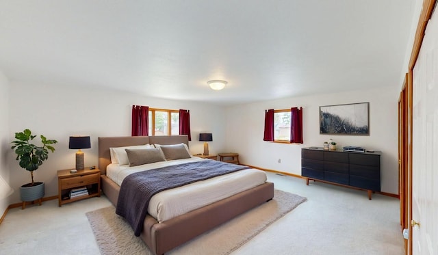 944 Long Point Dr, Houghton Lake, MI 48629 - bedroom with light carpet and baseboards