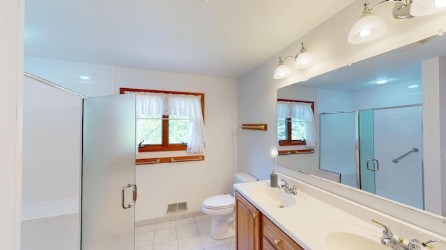 944 Long Point Dr, Houghton Lake, MI 48629 - bathroom with a stall shower, double vanity, toilet, and tile patterned floors