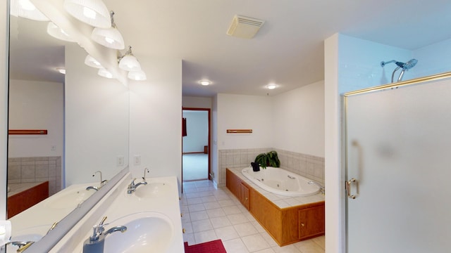 944 Long Point Dr, Houghton Lake, MI 48629 - full bath with tile patterned floors, a shower stall, a tub with jets, and double vanity