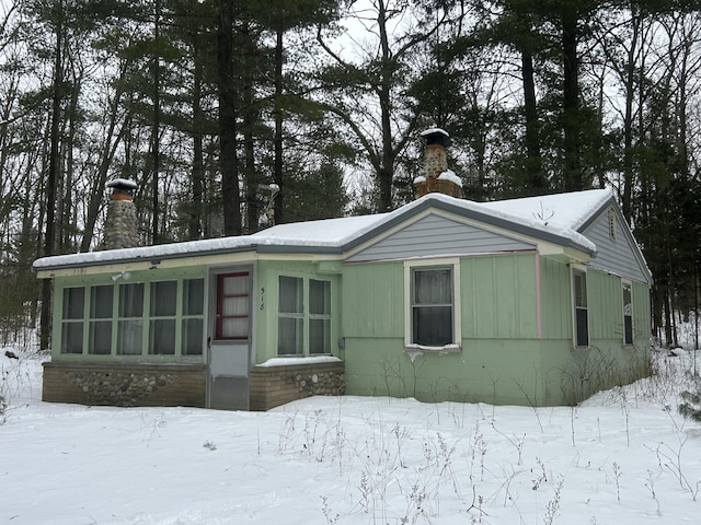 view of front of house with a chimney