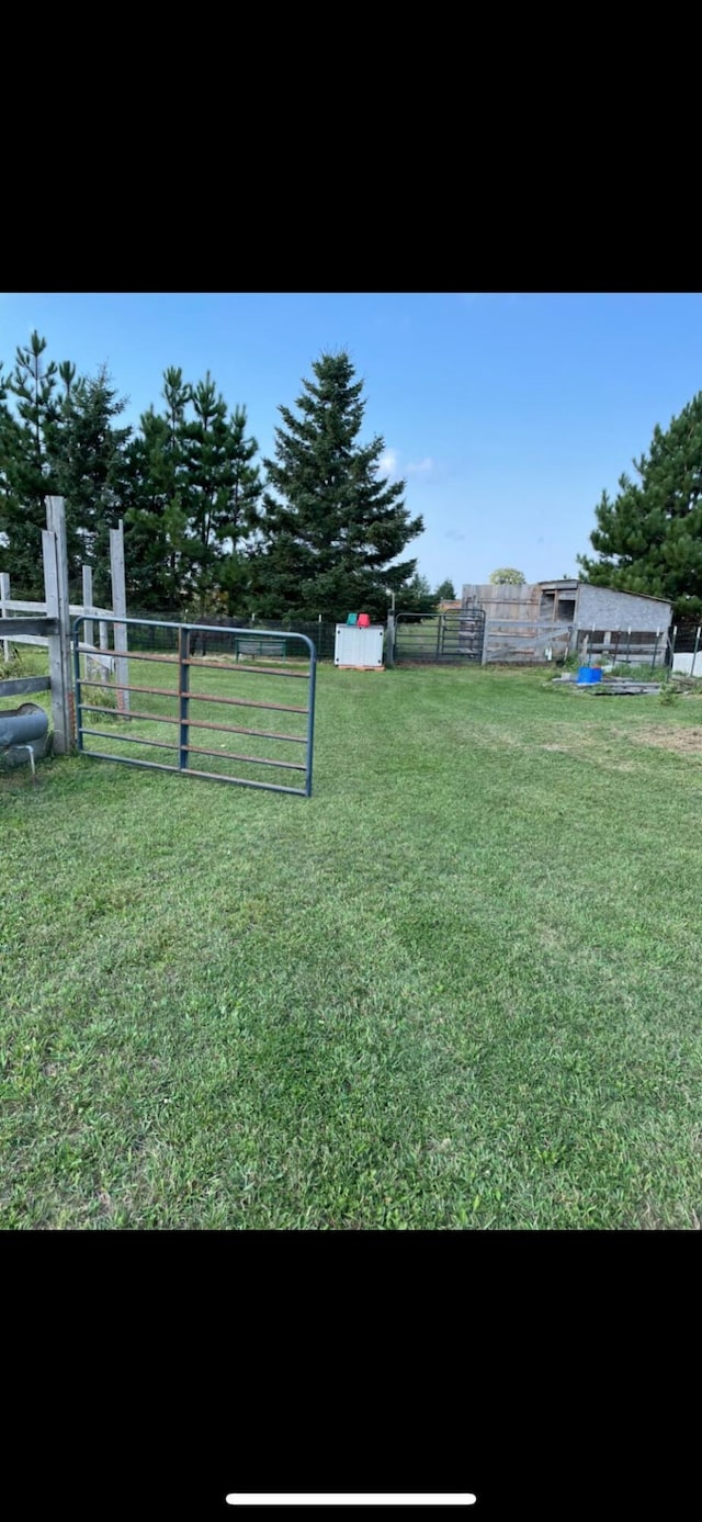 view of yard with a gate and fence