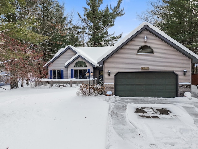 view of front of property featuring brick siding and a garage