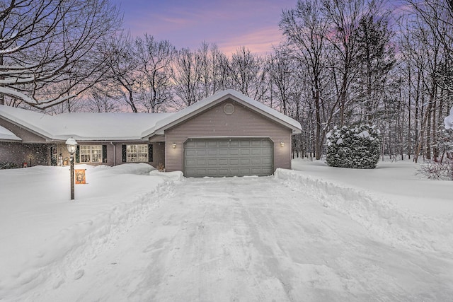 view of front of property with brick siding and a garage