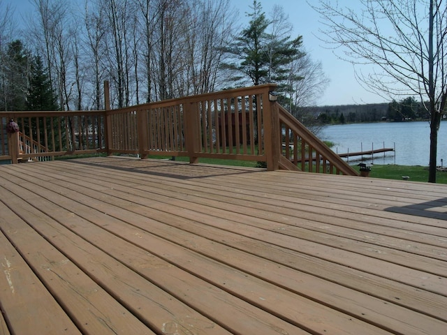 15117 Valley Dr, Wolverine, MI 49799 - wooden deck featuring a water view