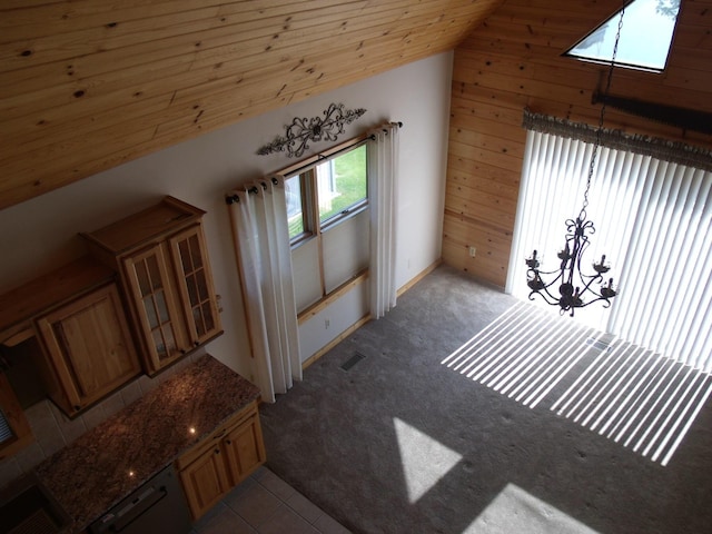 15117 Valley Dr, Wolverine, MI 49799 - bonus room with vaulted ceiling, carpet floors, and wood walls