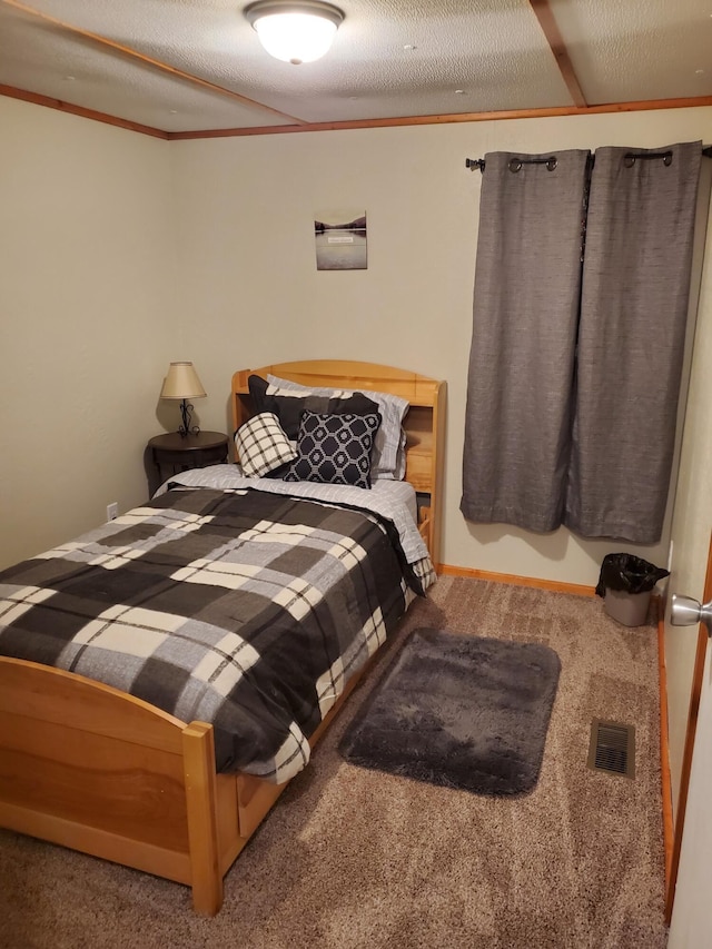 bedroom with visible vents and crown molding