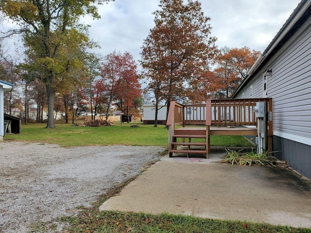 view of yard with a wooden deck