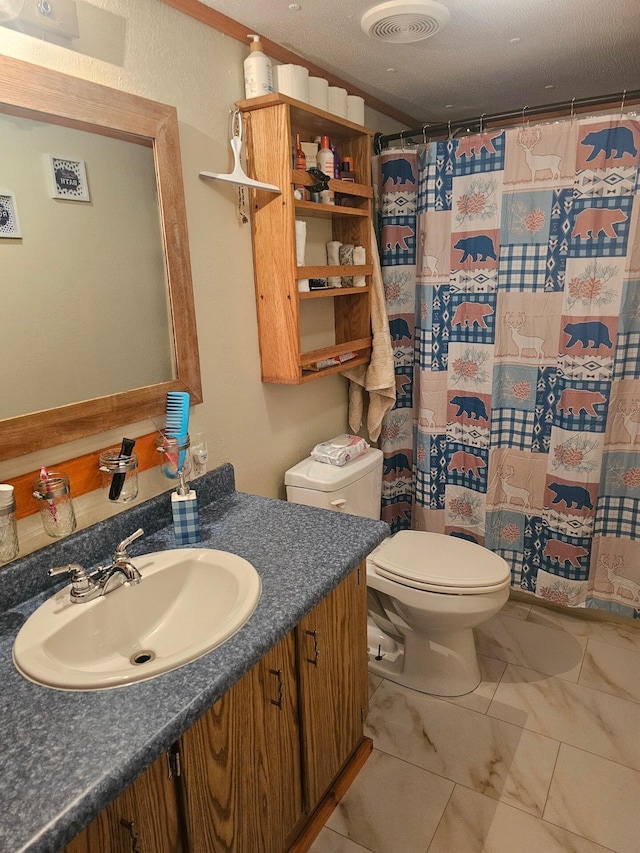 full bathroom with visible vents, toilet, marble finish floor, a textured ceiling, and vanity