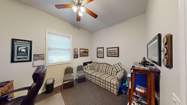 carpeted home office featuring baseboards and ceiling fan