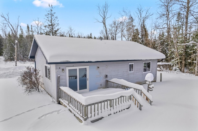 view of snow covered house