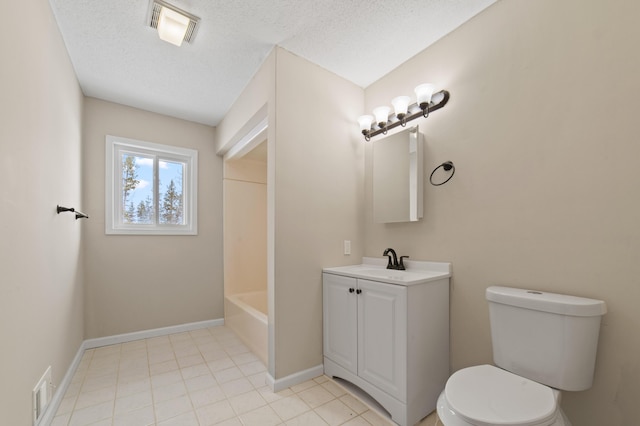 bathroom featuring visible vents, baseboards, toilet, vanity, and a textured ceiling