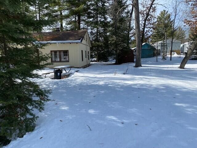 view of yard covered in snow