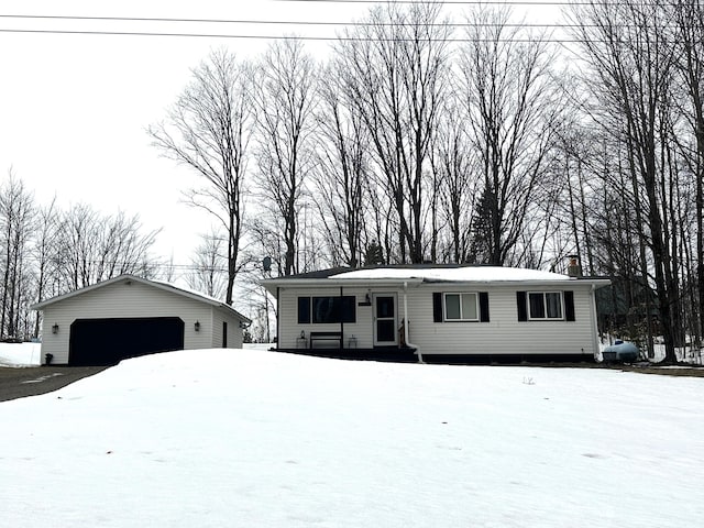 view of front of house with an outbuilding and a detached garage