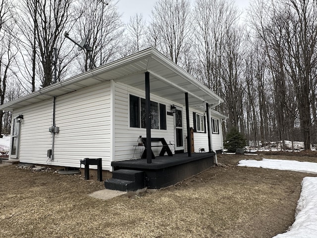 view of side of property featuring a porch