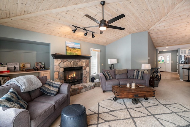 carpeted living room featuring a ceiling fan, track lighting, a fireplace, lofted ceiling, and wood ceiling