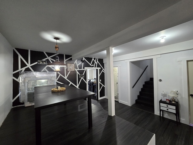 dining area with stairway and wood finished floors