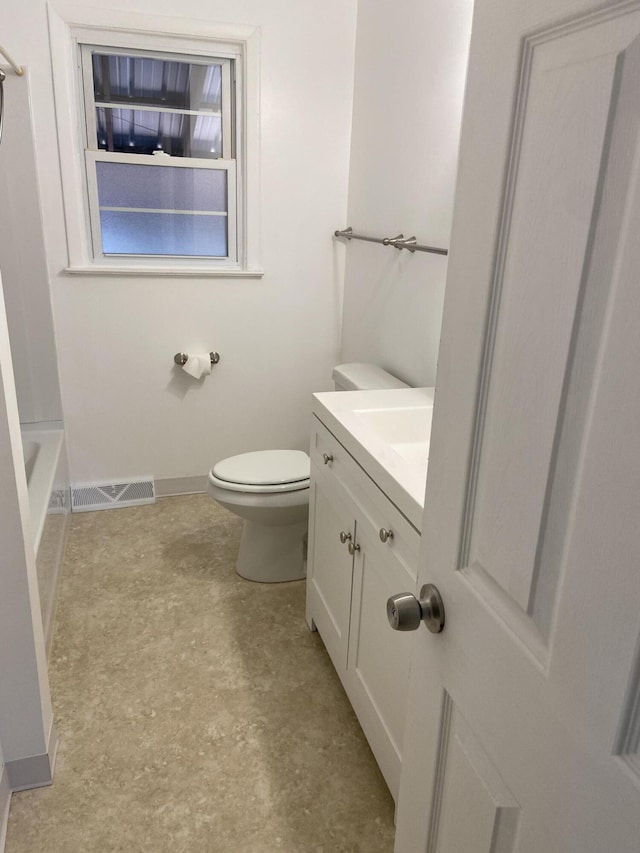 full bath with visible vents, toilet, baseboards, walk in shower, and vanity