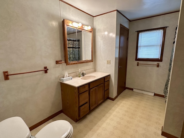 916 W First St, Cheboygan, MI 49721 - bathroom with a baseboard radiator, tile patterned floors, toilet, vanity, and crown molding