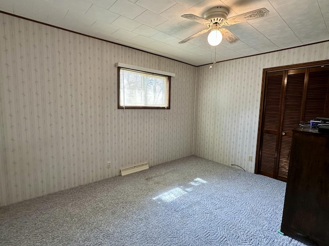 916 W First St, Cheboygan, MI 49721 - unfurnished bedroom with visible vents, ceiling fan, a closet, and carpet flooring