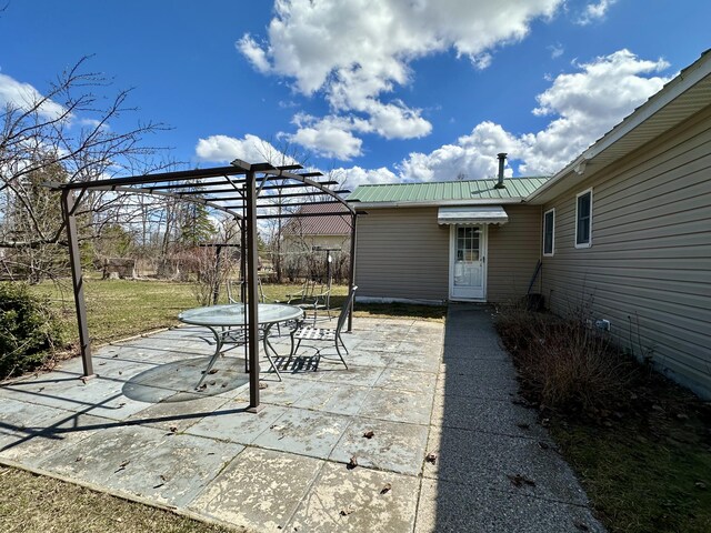 916 W First St, Cheboygan, MI 49721 - view of patio featuring a pergola