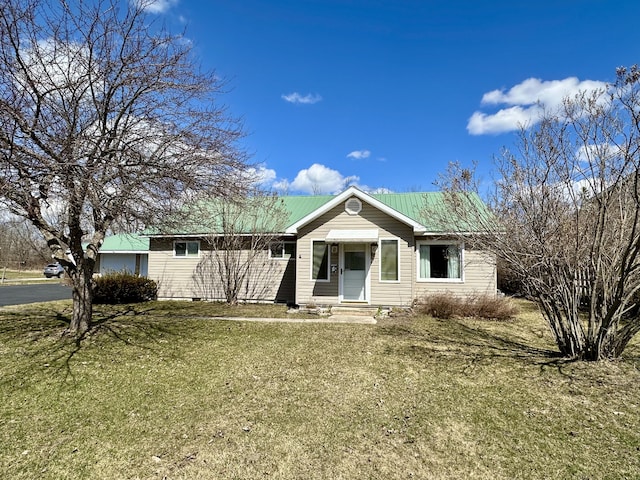 916 W First St, Cheboygan, MI 49721 - view of front of house featuring a front lawn and entry steps
