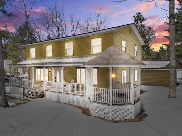 view of front of property featuring covered porch