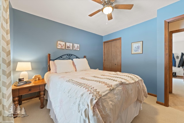 bedroom with a closet, carpet flooring, ceiling fan, and baseboards