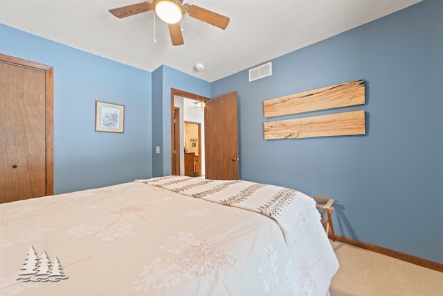 carpeted bedroom featuring visible vents, a ceiling fan, and baseboards