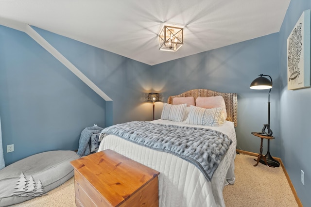 bedroom featuring baseboards and carpet