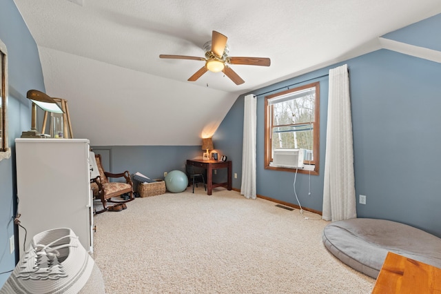 interior space featuring visible vents, carpet flooring, baseboards, and vaulted ceiling