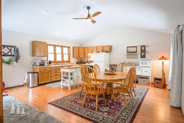 dining area featuring baseboards, recessed lighting, ceiling fan, vaulted ceiling, and light wood-style floors