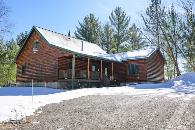 cabin featuring covered porch