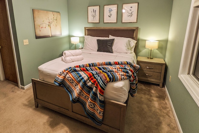 carpeted bedroom with baseboards