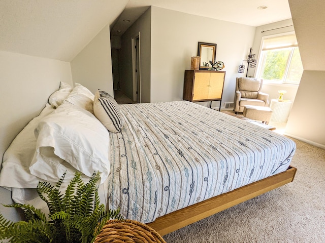 carpeted bedroom featuring baseboards