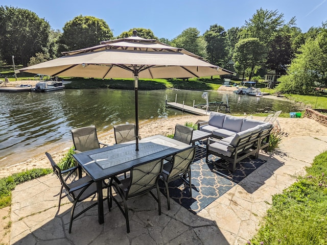 view of patio featuring outdoor dining space, an outdoor hangout area, and a water view