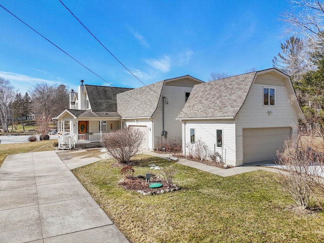 dutch colonial with a gambrel roof, covered porch, and driveway