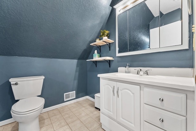 half bath with visible vents, baseboards, toilet, and a textured ceiling