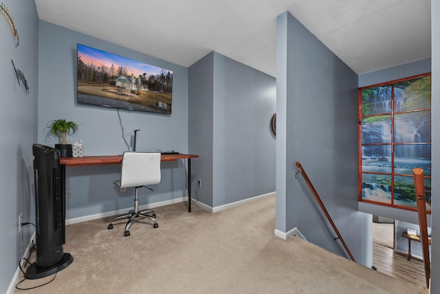 carpeted office featuring baseboards