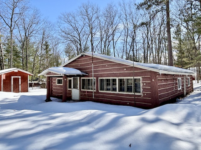 chalet / cabin with an outbuilding