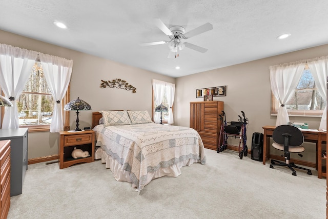 bedroom with recessed lighting, baseboards, light carpet, and a ceiling fan